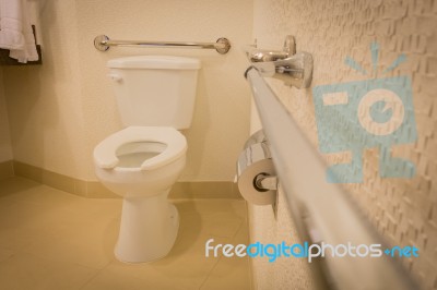 Disabled Toilet Bathroom With Grab Bars In White Interior Design Hotel Stock Photo