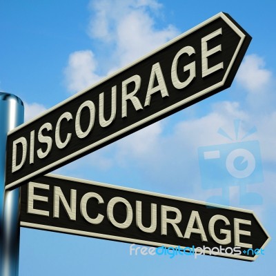 Discourage Or Encourage Directions On A Signpost Stock Image