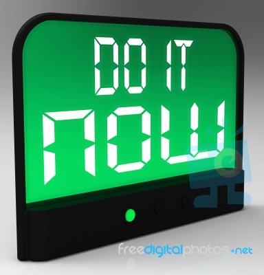 Do It  Now Clock Showing Urgency For Action Stock Image