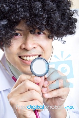 Doctor Holding Stethoscope Stock Photo