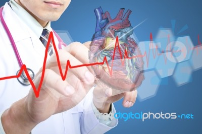 Doctor Holding Stethoscope Stock Photo