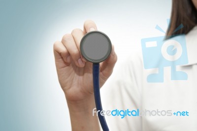 Doctor Holding Stethoscope Stock Photo