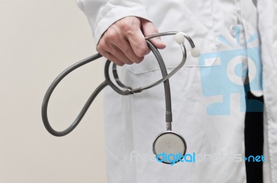 Doctor Holding Stethoscope Stock Photo