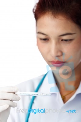 Doctor Reading Thermometer Stock Photo