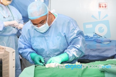 Doctor Using Tools In A Surgery Stock Photo
