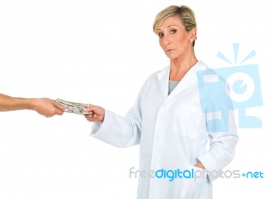 Doctor Woman Receiving Money From A Person Stock Photo