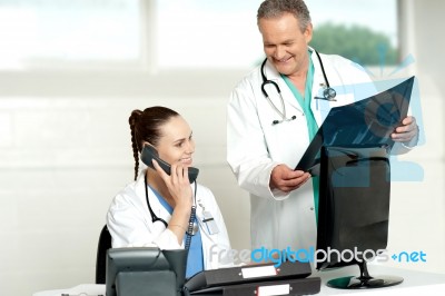 Doctors Discussing X Ray Report Stock Photo