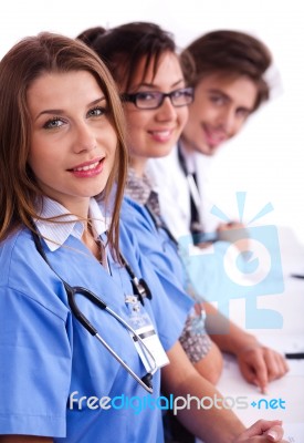 Doctors In Hospital Gowns In Row Stock Photo