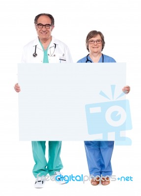 Doctors Showing Blank Board Stock Photo