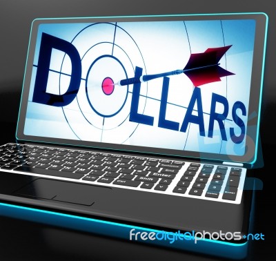 Dollars On Laptop Shows Financial Currencies Stock Image