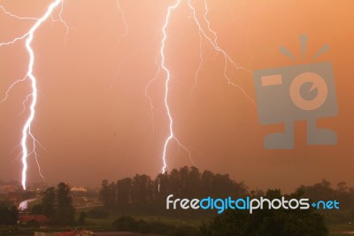Double Vertical Lightning At Sunset Stock Photo