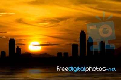 Dramatic Pattaya Thailand Skyline Behind Clouds Above The Sea Stock Photo