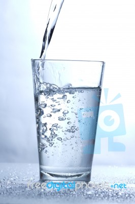 Drinking water pouring into glass Stock Photo