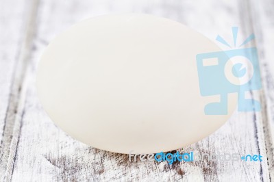 Duck Egg On White Painted Table Surface Stock Photo