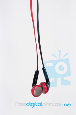 Ear Buds Or Earphones Vertical On White Background Stock Photo