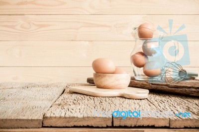 Egg, Chicken Egg In Wood Bowl On Old Wooden Table Stock Photo