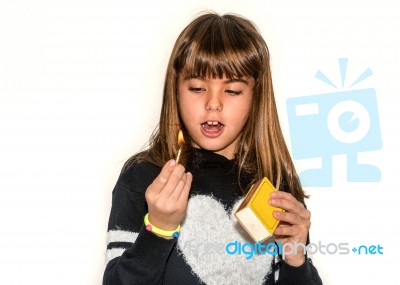 Eight Year Old Girl Playing With Maches Isolatet On White Stock Photo