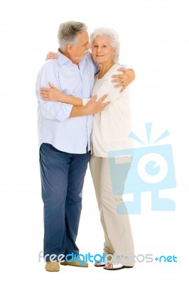 Elderly Couple Enbracing Stock Photo