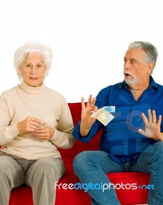 Elderly Couple Holding Money Stock Photo