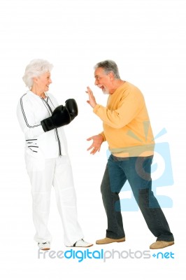 Elderly Couple With Boxing Gloves Stock Photo