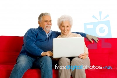 Elderly Couple With Laptop Stock Photo