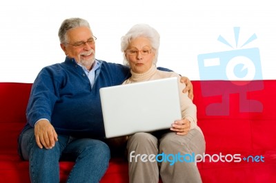 Elderly Couple With Laptop Stock Photo