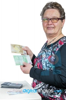 Elderly Woman Counting And Showing Money Stock Photo