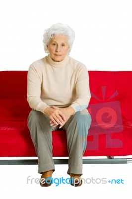 Elderly Woman On The Couch Stock Photo