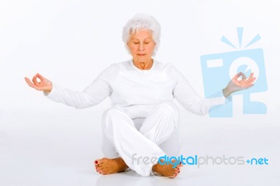 Elderly Woman Practicing Yoga Stock Photo