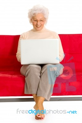 Elderly Woman With Laptop Stock Photo