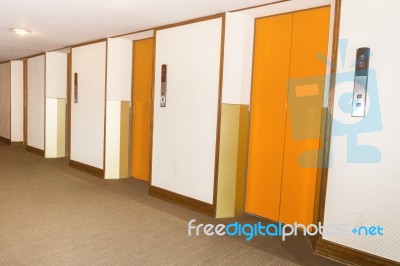 Elevators Orange Color In Hotel Lobby Stock Photo