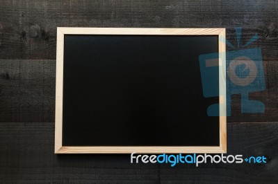 Empty Chalkboard On Wooden Background Stock Photo