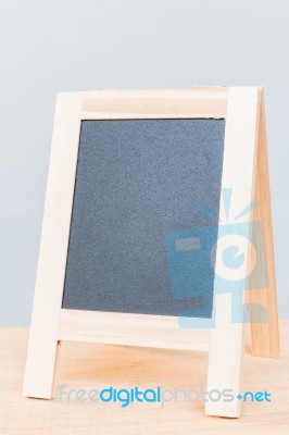 Empty Chalkboard On Wooden Board And Gray Background Stock Photo