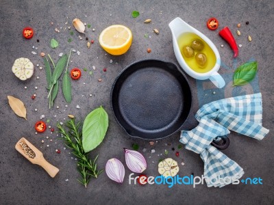 Empty Old Cast Iron Skille On Dark Stone Background. Ingredients… Stock Photo