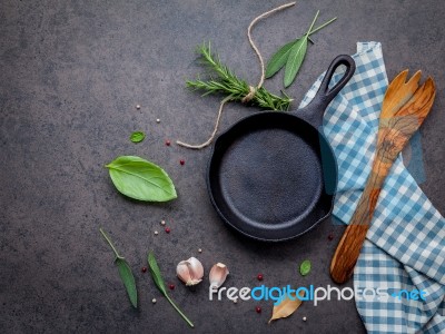 Empty Old Cast Iron Skille On Dark Stone Background. Ingredients… Stock Photo