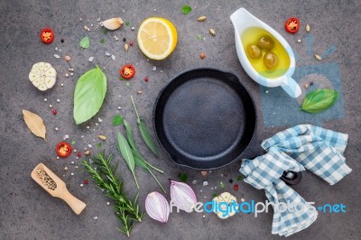 Empty Old Cast Iron Skille On Dark Stone Background. Ingredients… Stock Photo