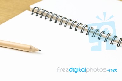 Empty Pages Of Opened Notebook With Pencil Stock Photo