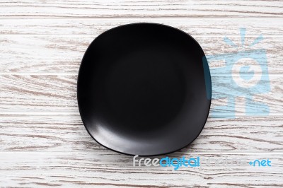 Empty Plate On White Wooden Table Background  Flat Lay Stock Photo