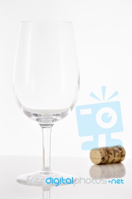 Empty Red Wine Glass And Wine Bottle Cork Stock Photo