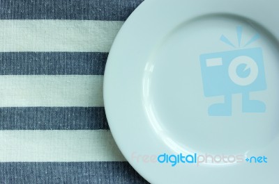 Empty White Plate With Tablecloth Stock Photo