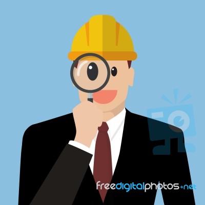 Engineer Looking Through A Magnifying Glass Stock Image