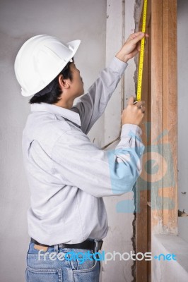 Engineer Man Metering By Tape Measure Stock Photo