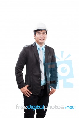 Engineering Man Wearing White Safety Helmet Standing And Smiling… Stock Photo