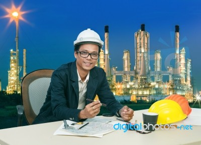 Engineering Man Working On Table Aginst Beautifult Lighting Of O… Stock Photo