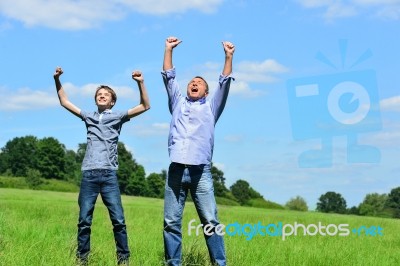 Enthusiastic Father And Son Outdoors Stock Photo