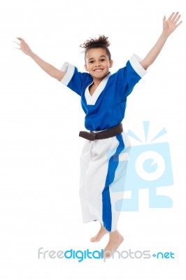 Enthusiastic Young Girl Kid In Karate Uniform Stock Photo
