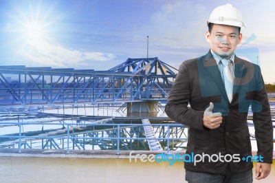 Environmental Engineering Man Standing In Front Of Waterworks In… Stock Photo