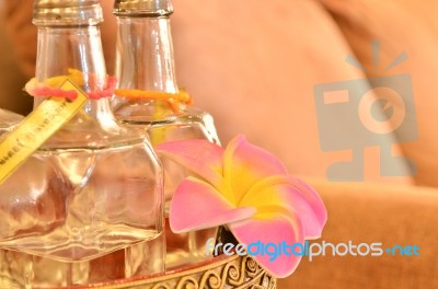 Essence Of Flower - Glass Bottle With Pink Flower Stock Photo