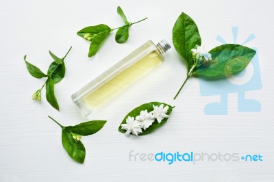 Essential Oil With Jasmine  Flower On White Background Stock Photo