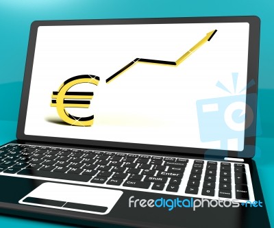Euro Sign And Up Arrow On Computer For Earnings Or Profit Stock Image
